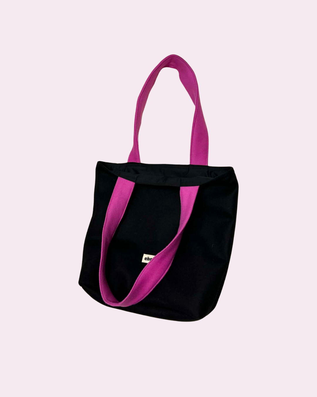 jane-sac-reversible-noir-rose-impermeable-1.png