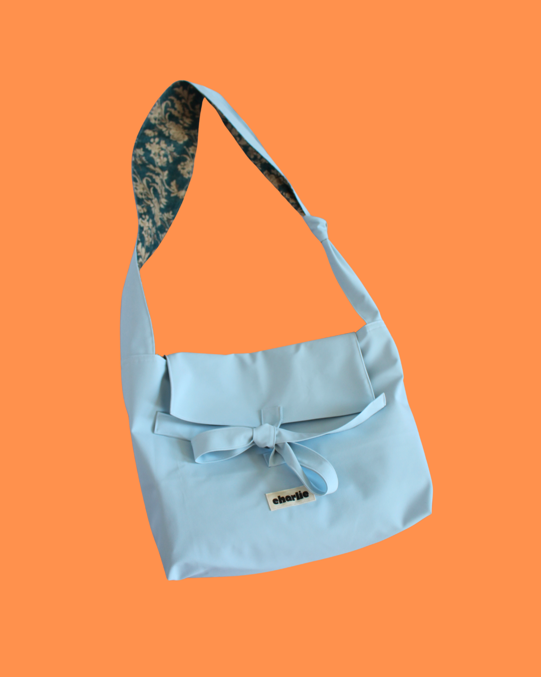 olivia-bandouliere-impermeable-baby-blue-1.png