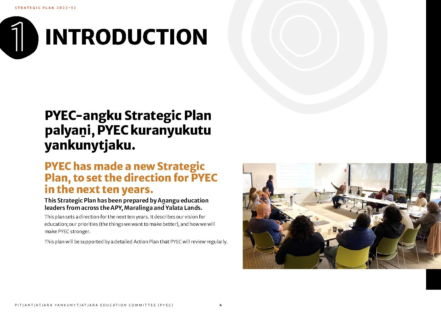 Title page of a strategic plan document with the heading 'Introduction' and a photograph showing a diverse group of people attending a workshop or meeting in a modern conference room, with one person giving a presentation.