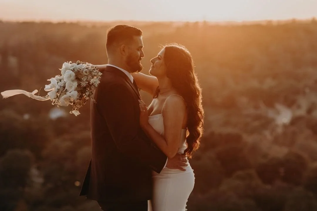 Laurie’s customers, Larissa and Emmett, just married walking off the aisle together.