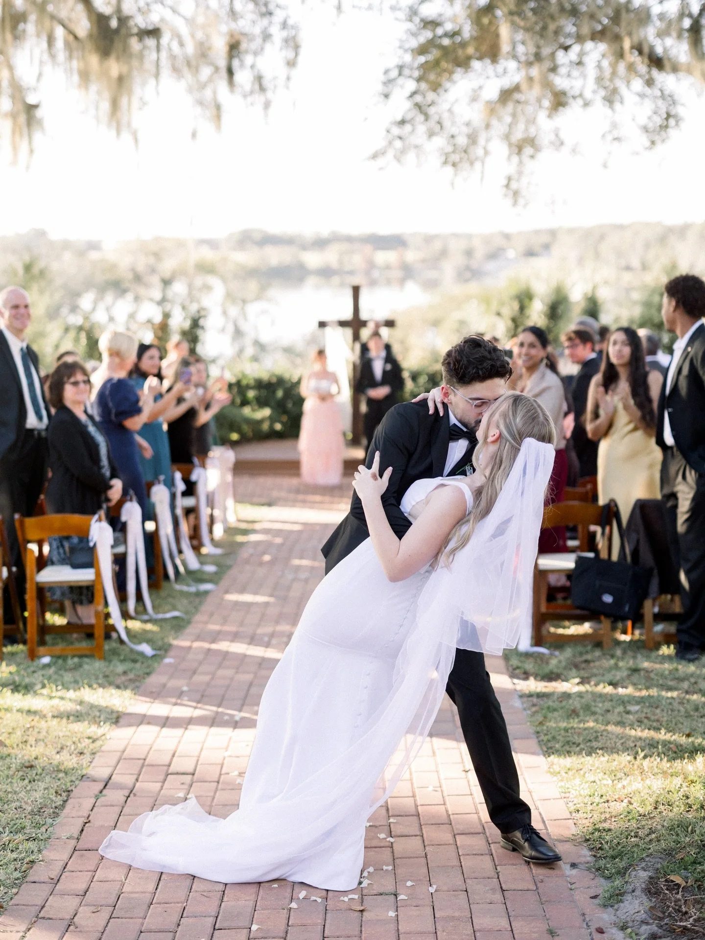 A perfect day for a perfect pair 🤍 ⛪️

Venue - @lakeviewgardensfl 
Associate Photographer @casiemariephotography 
Second Photographer @maryfoskyphotography 
Videographer - @alyandresmedia 
Catering - @thefamilyempanadasllc 
Hair &amp; Makeup - @behi