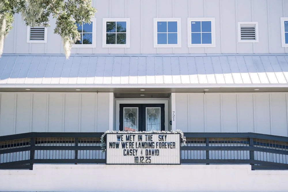 White exterior and wedding marquee sign at The Grand 721 wedding venue in New Smyrna Beach, Florida