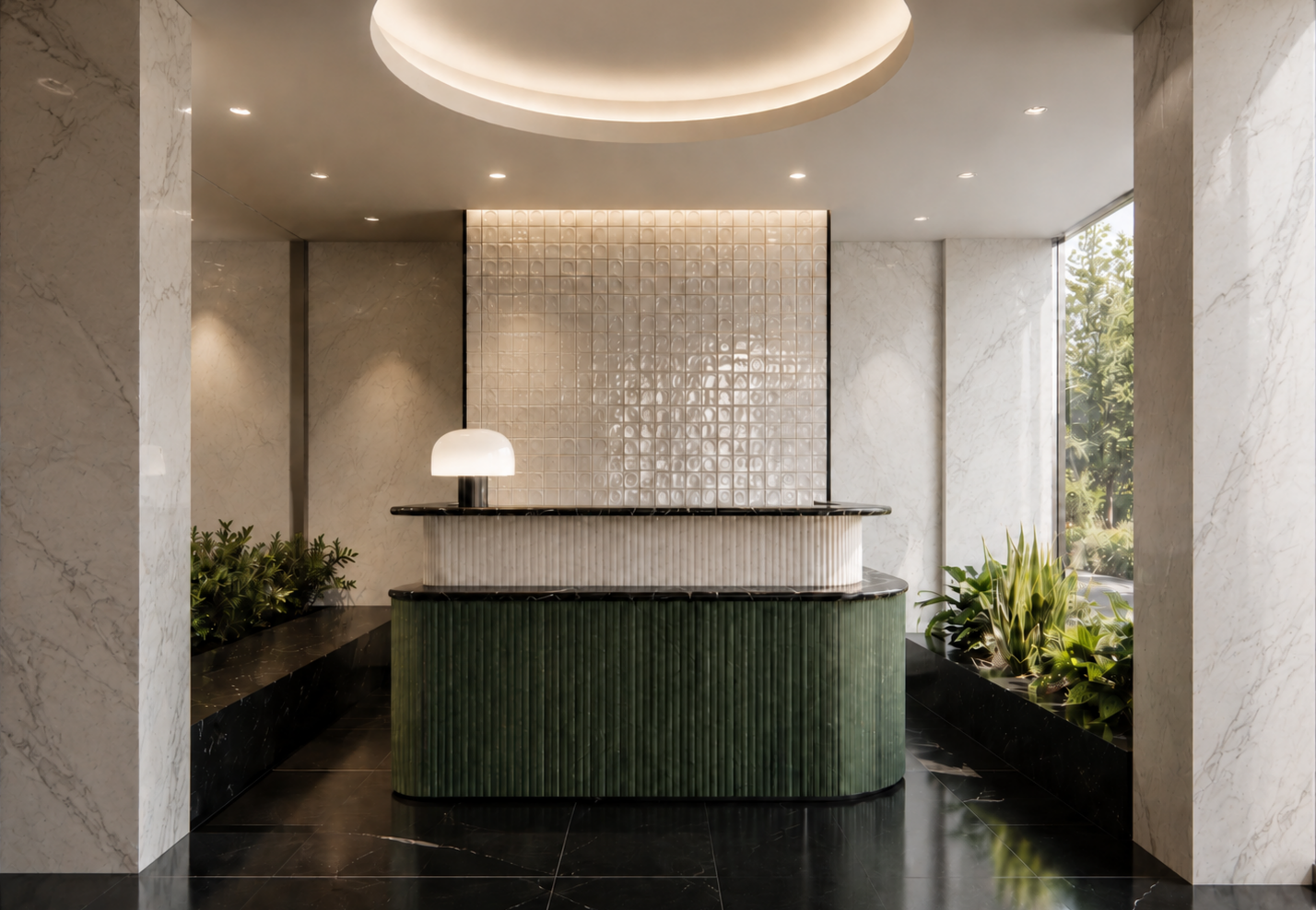Modern hotel lobby reception desk with green base, white top, and black marble accents, flanked by indoor plants and illuminated by ceiling lights, with large window providing natural light.
