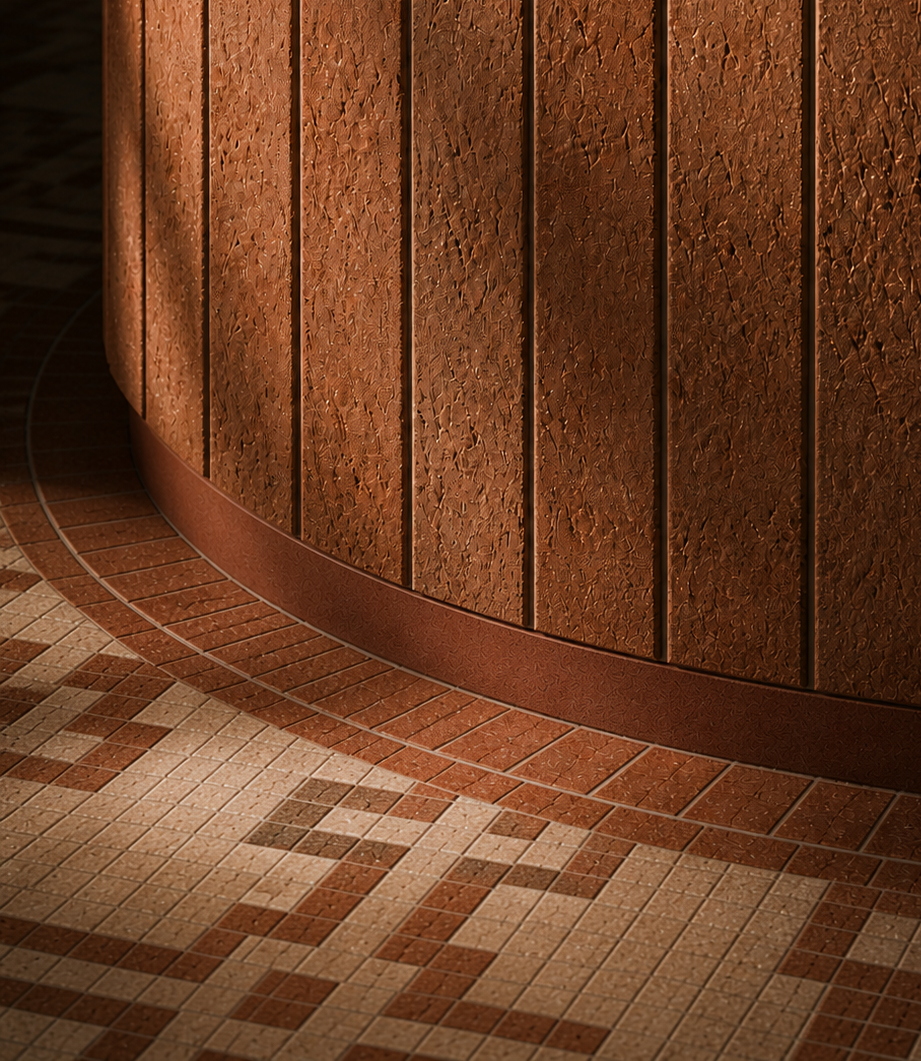 Close-up of a curved wooden wall with textured brown panels and mosaic tile flooring in earth tones.
