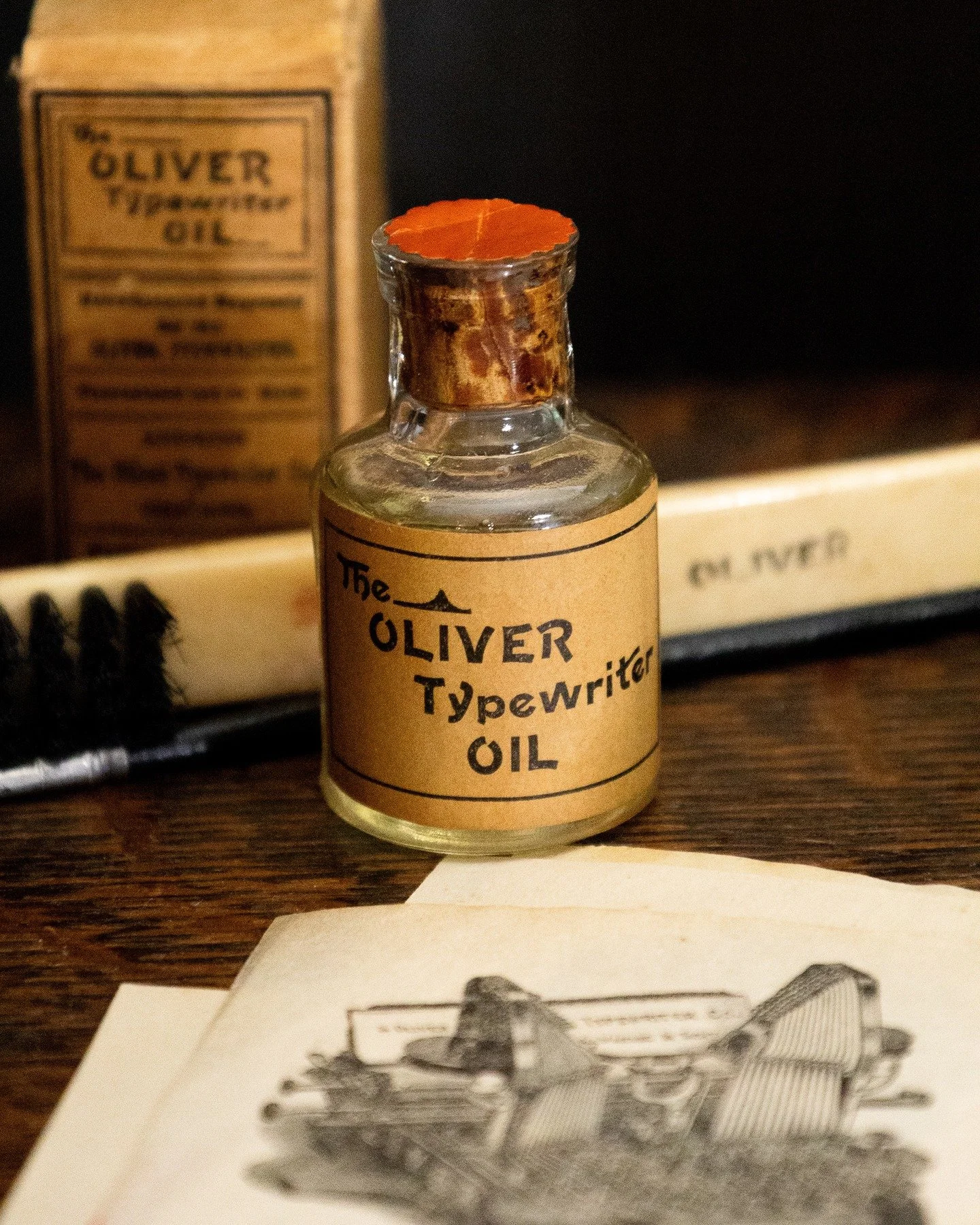 A factory-sealed Oliver Typewriter Oil bottle.