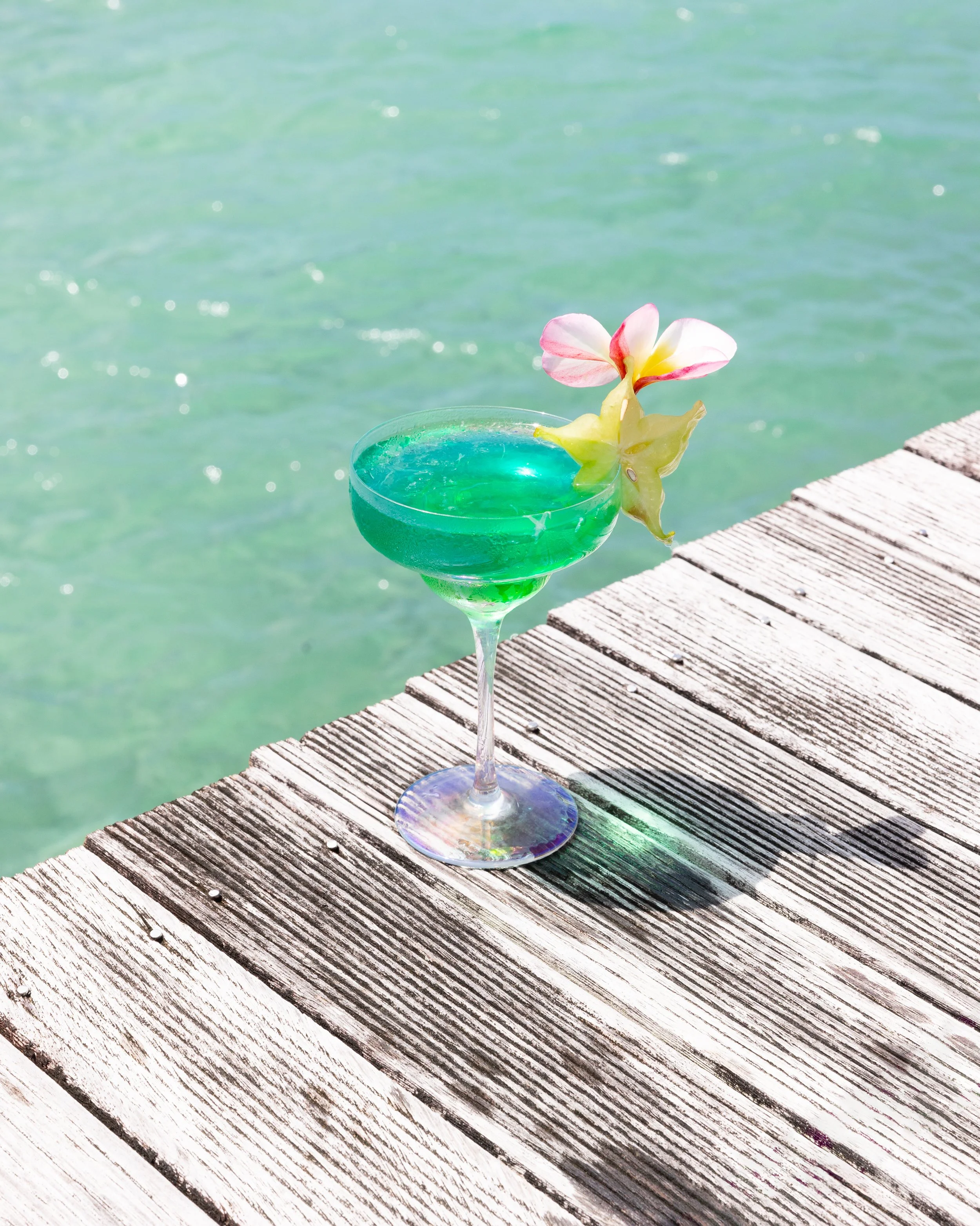 Cocktail on wooden pier in Samoa.