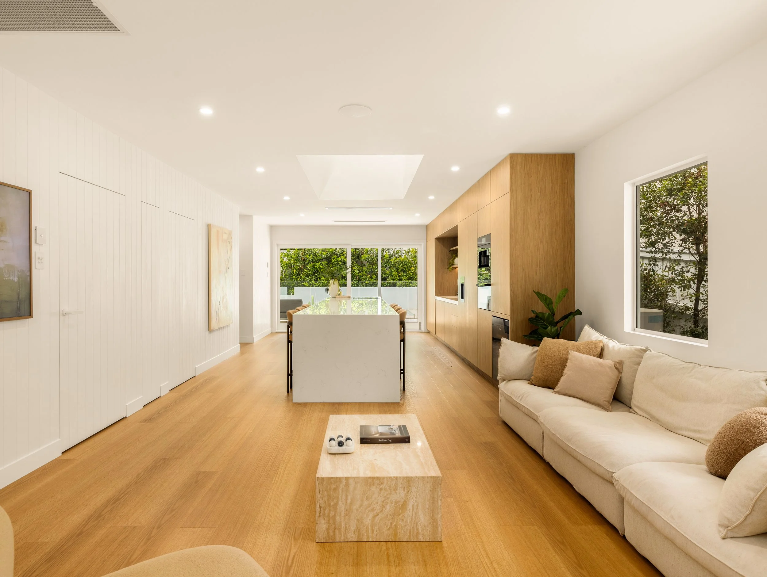 Newly renovated modern living room and kitchen in Brisbane City with modern fixtures and fitting. 