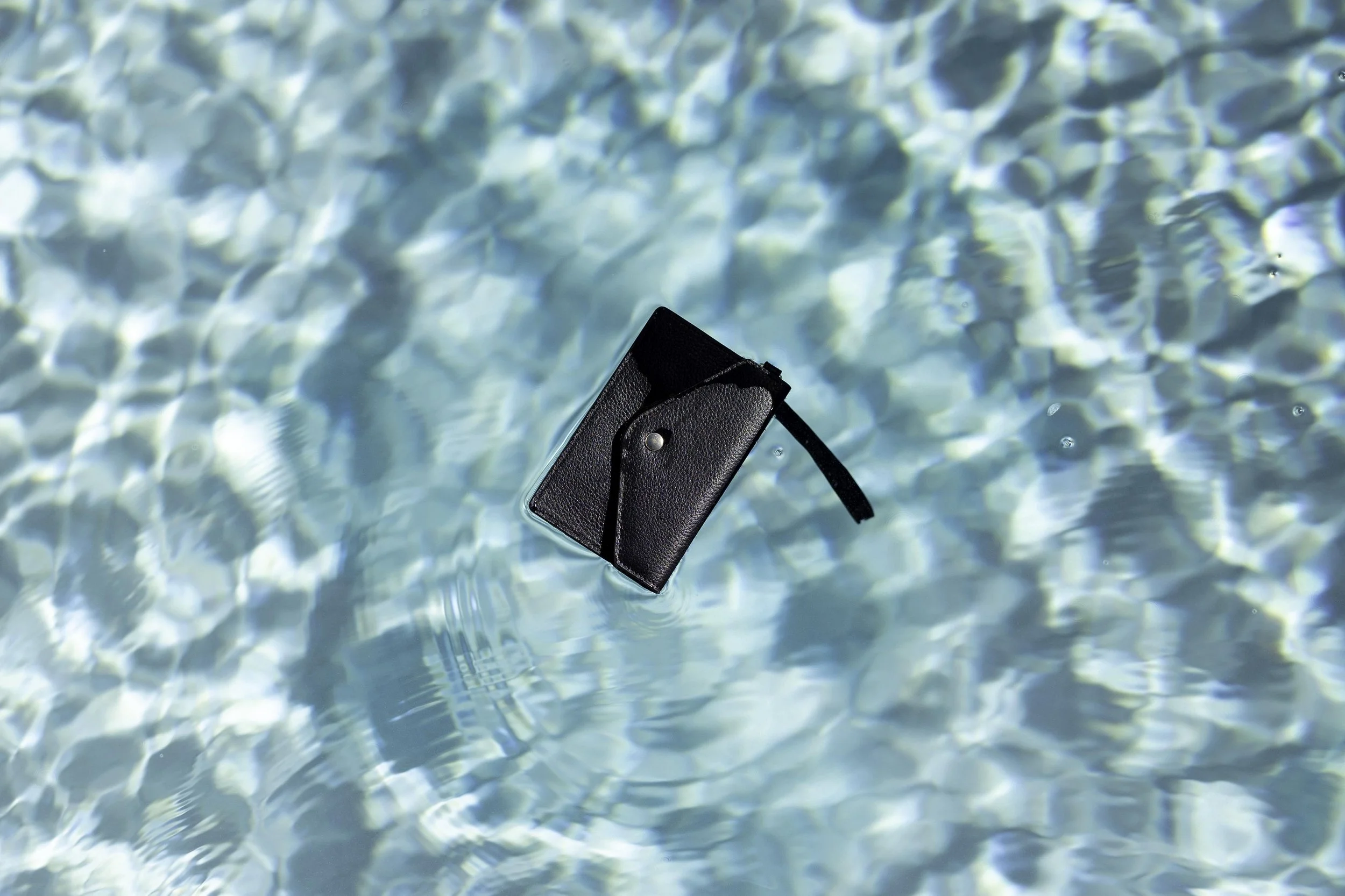 Bonnie & Kind wallet in luxury pool Brisbane City.