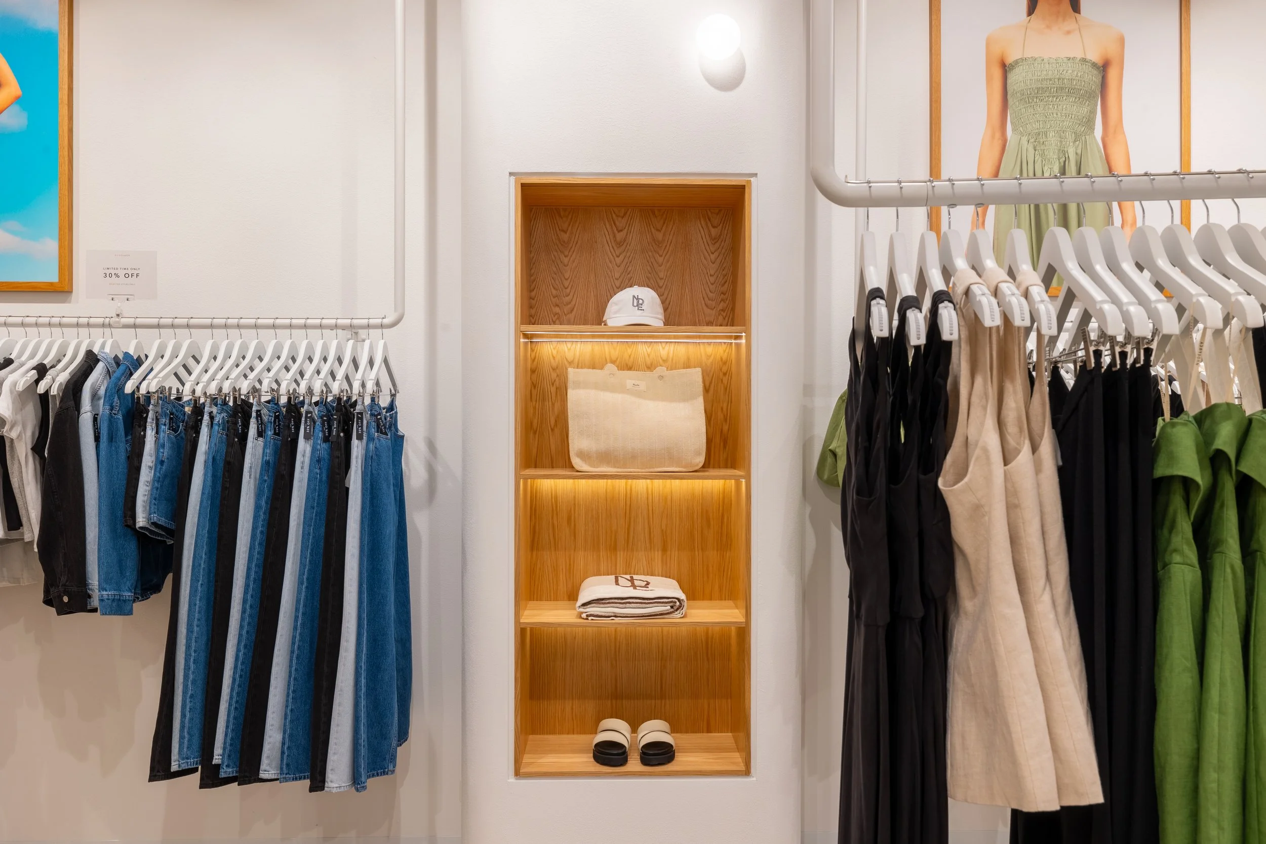 Nude Lucy cabinet display for clothing in Brisbane City.