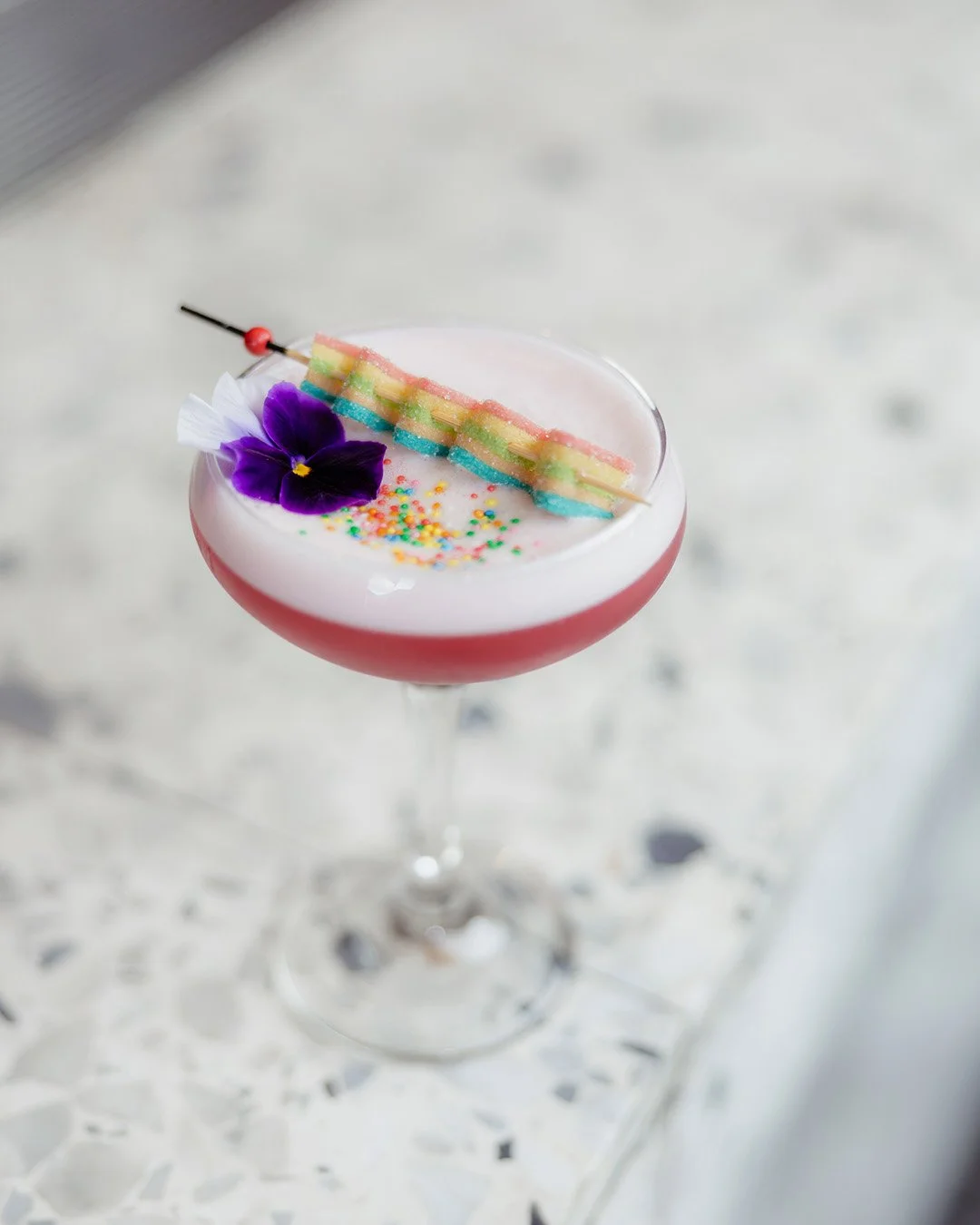 Cocktail with candy sitting on a bench at Everton Park Plaza.