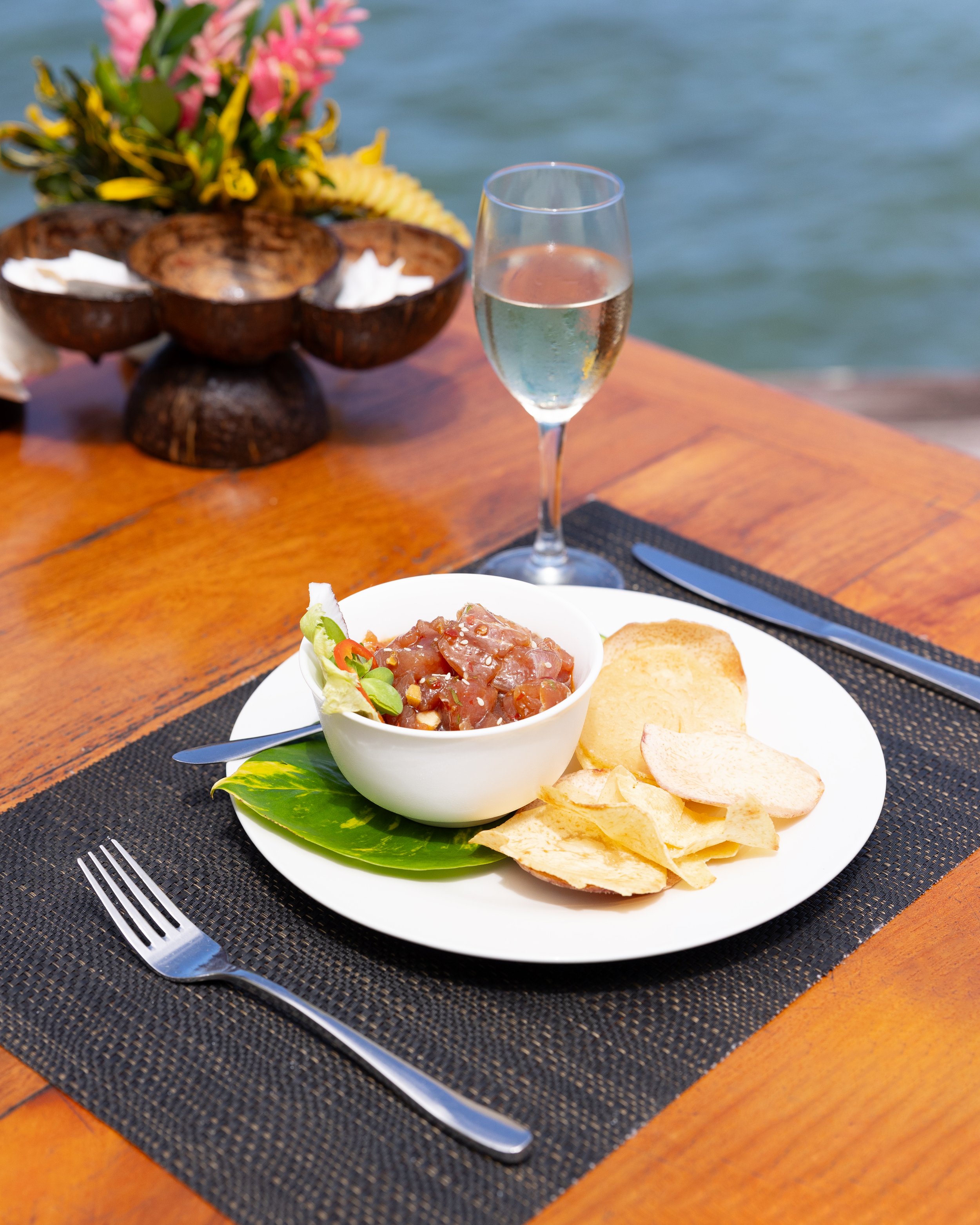 Traditional Samoan food with a beach front view.