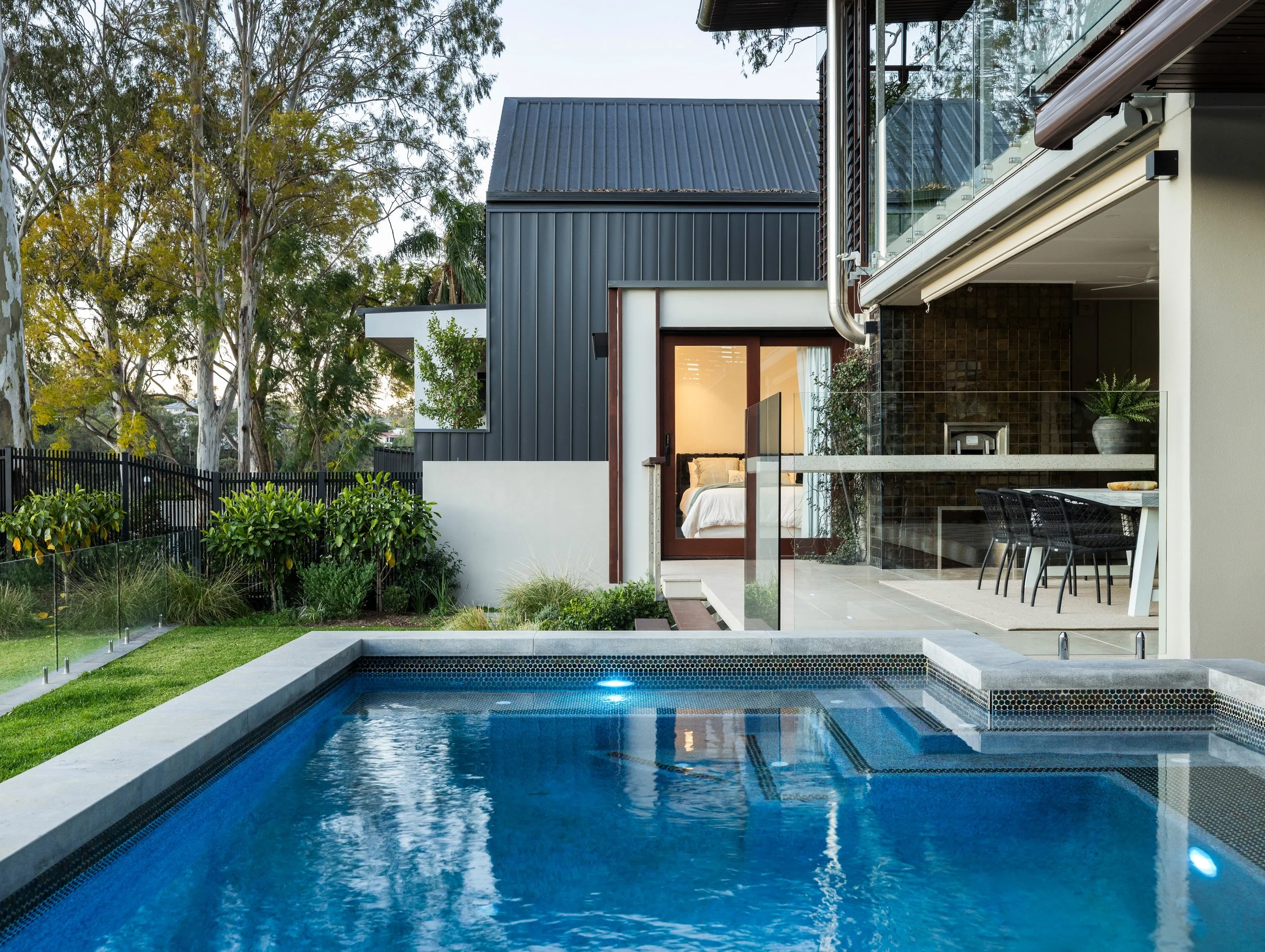 Bedroom add-on with a luxury, modern features overlooking Brisbane and a large inbuilt pool. 