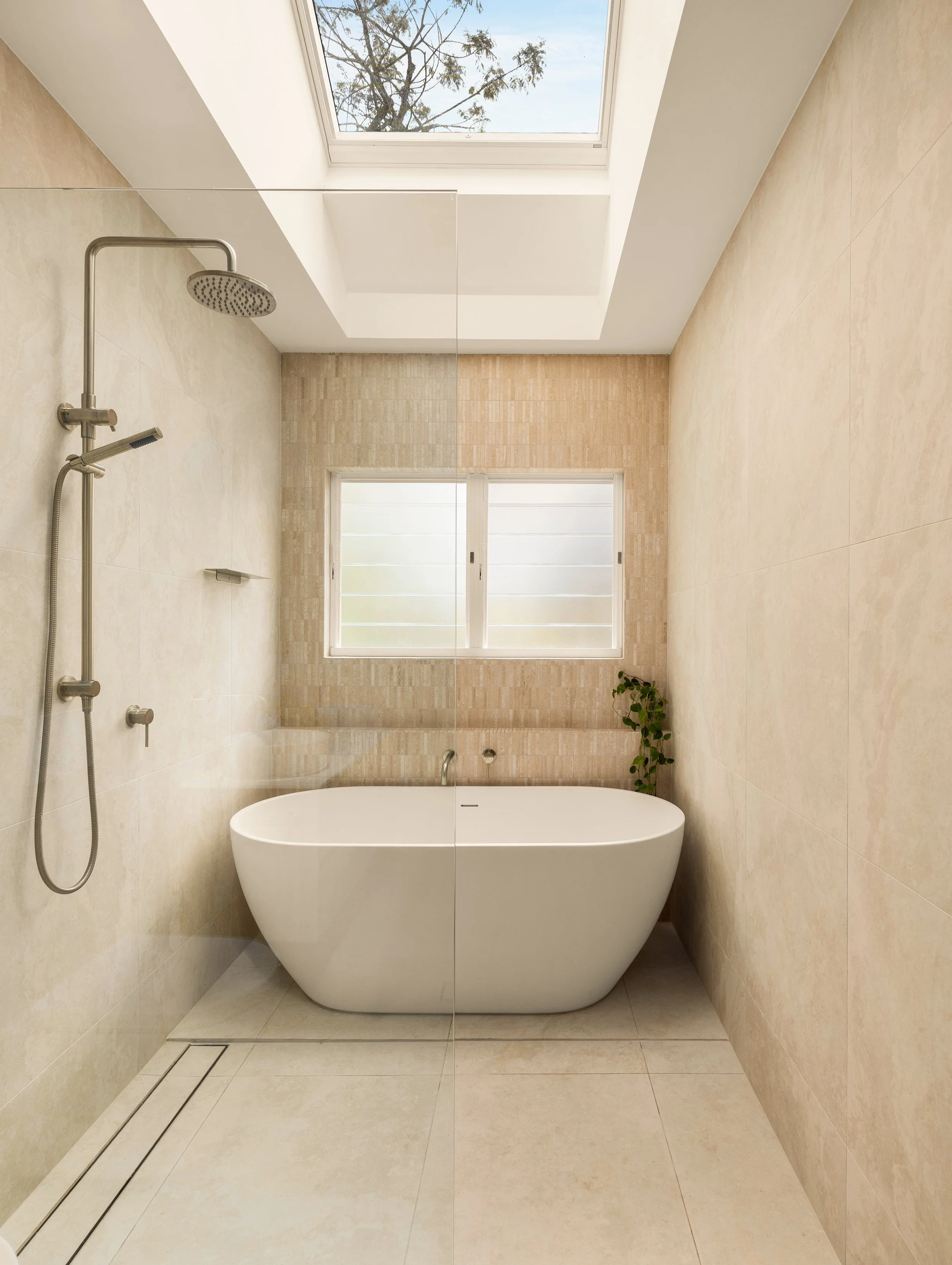 Modern luxury bathroom with a skylight and modern fitting in Brisbane, Bardon. 