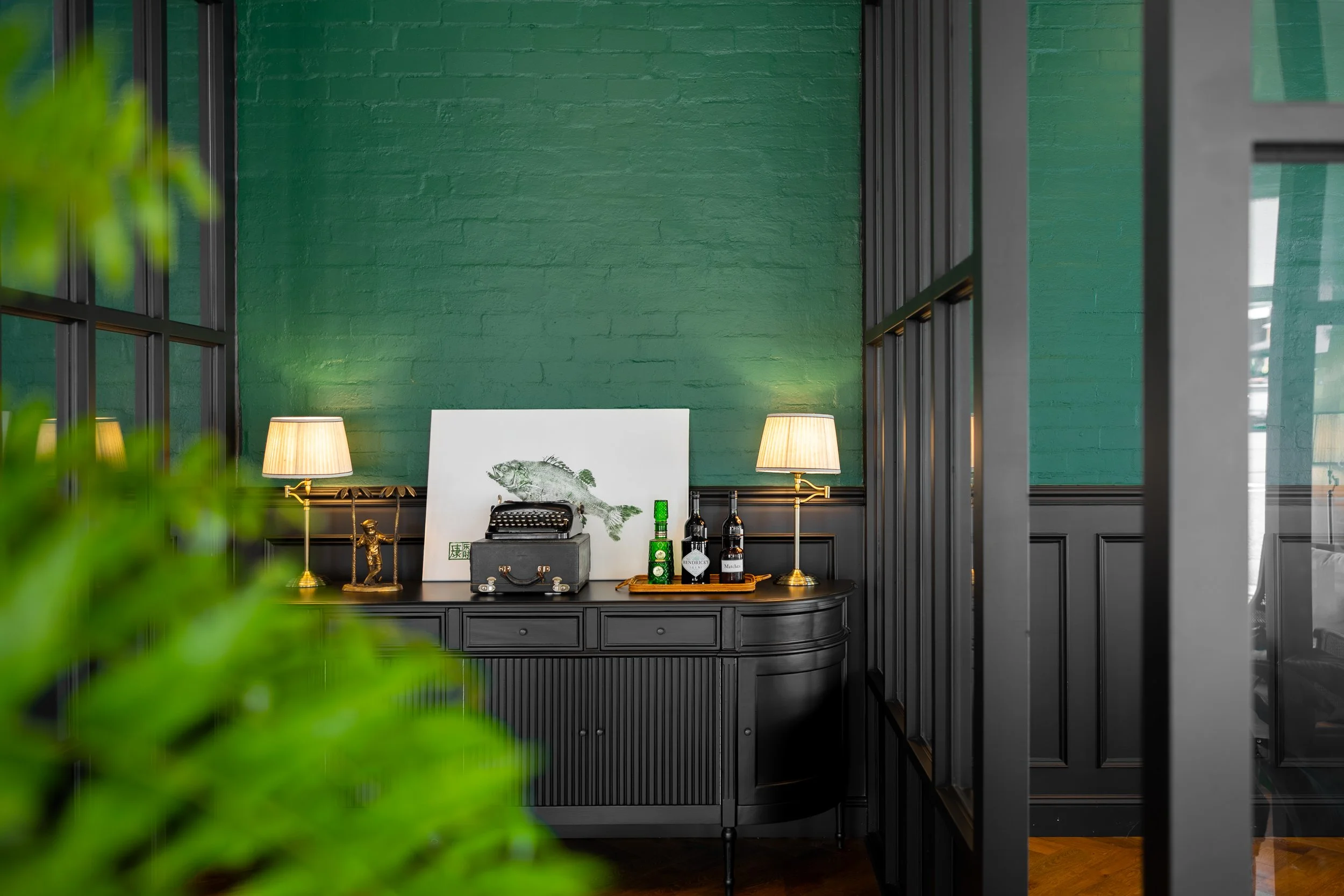 Unique dressing table with historical typewriter and finely aged whiskey in Brisbane City. 