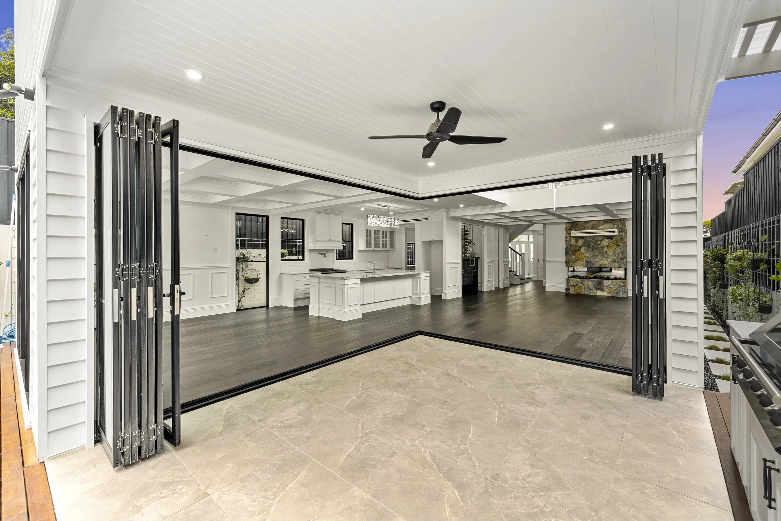 Luxury patio with large bifold doors located in Brisbane City.