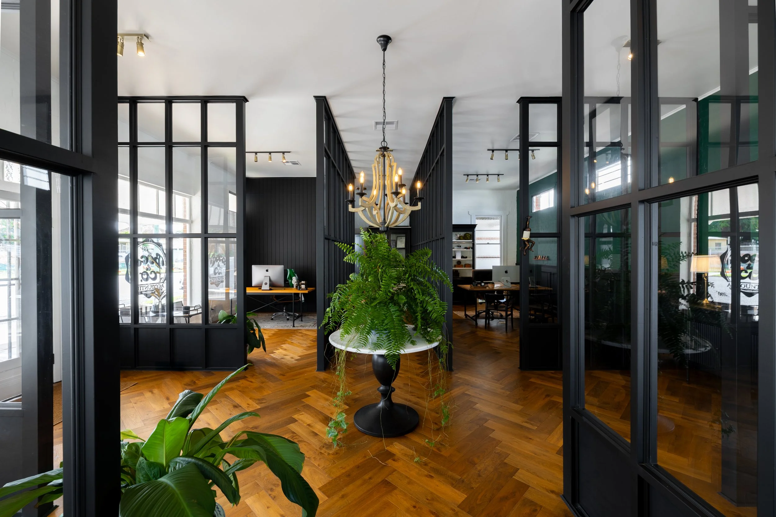 Large glass walls, wooden flooring commercial property in Brisbane City.