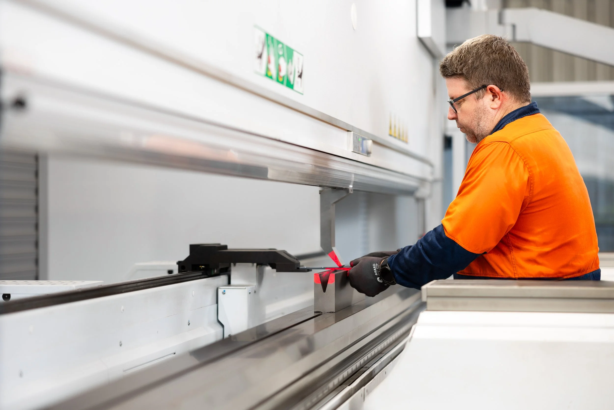 Grydale manufacturing worker bending steel used for Grydale products Brisbane.