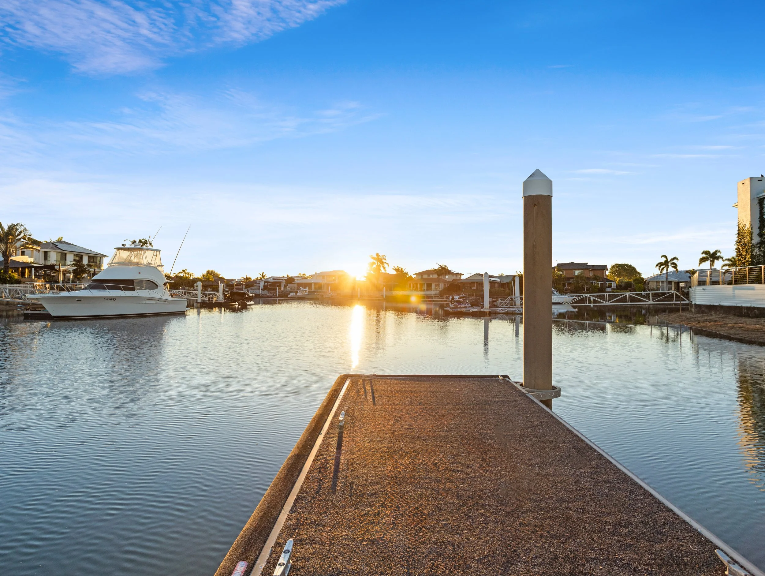 Sunset photo overlooking the Redcliffe canals with boats anchored. 