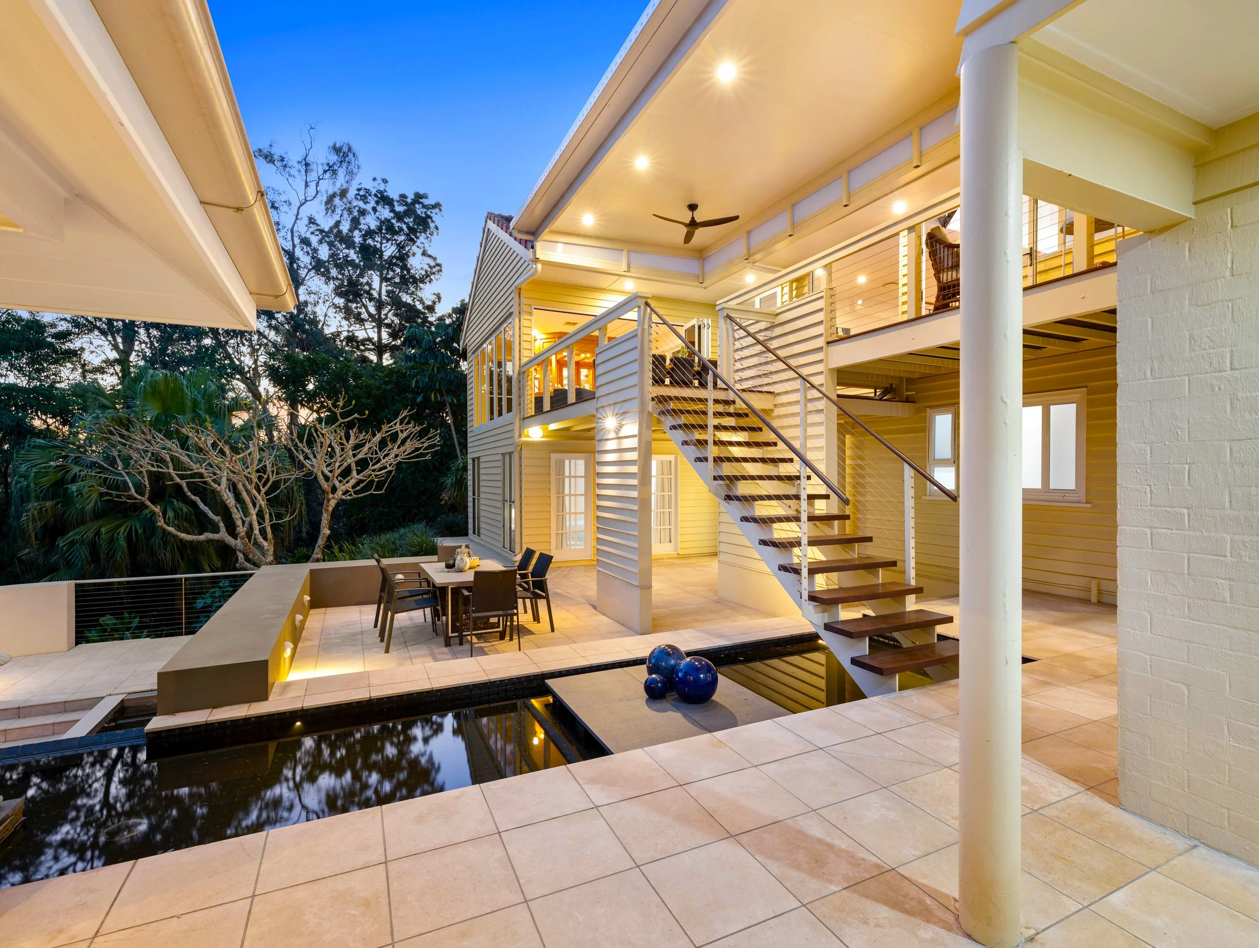 Large historical house in Brisbane shot at dusk.