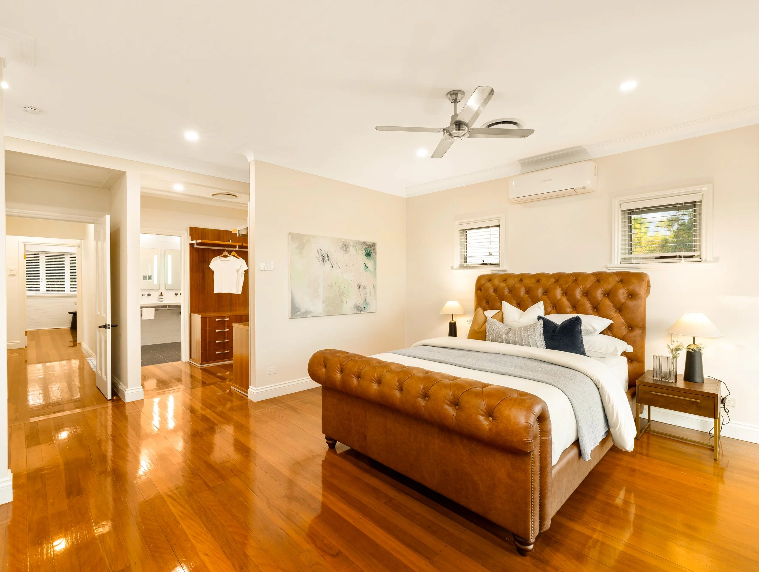 Large master bedroom with historical features in Brisbane City.