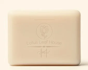 A beige closed box with a simple logo and the text 'Lotus Leaf House' on it.