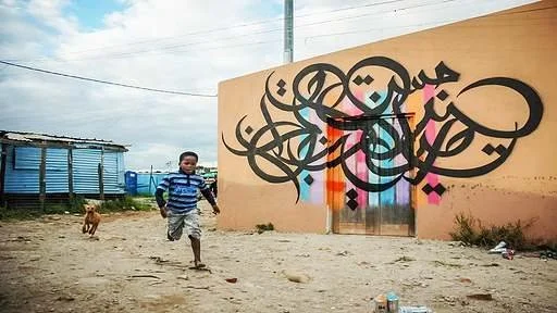   eL Seed, a mural in Khayelitsha, South Africa.  