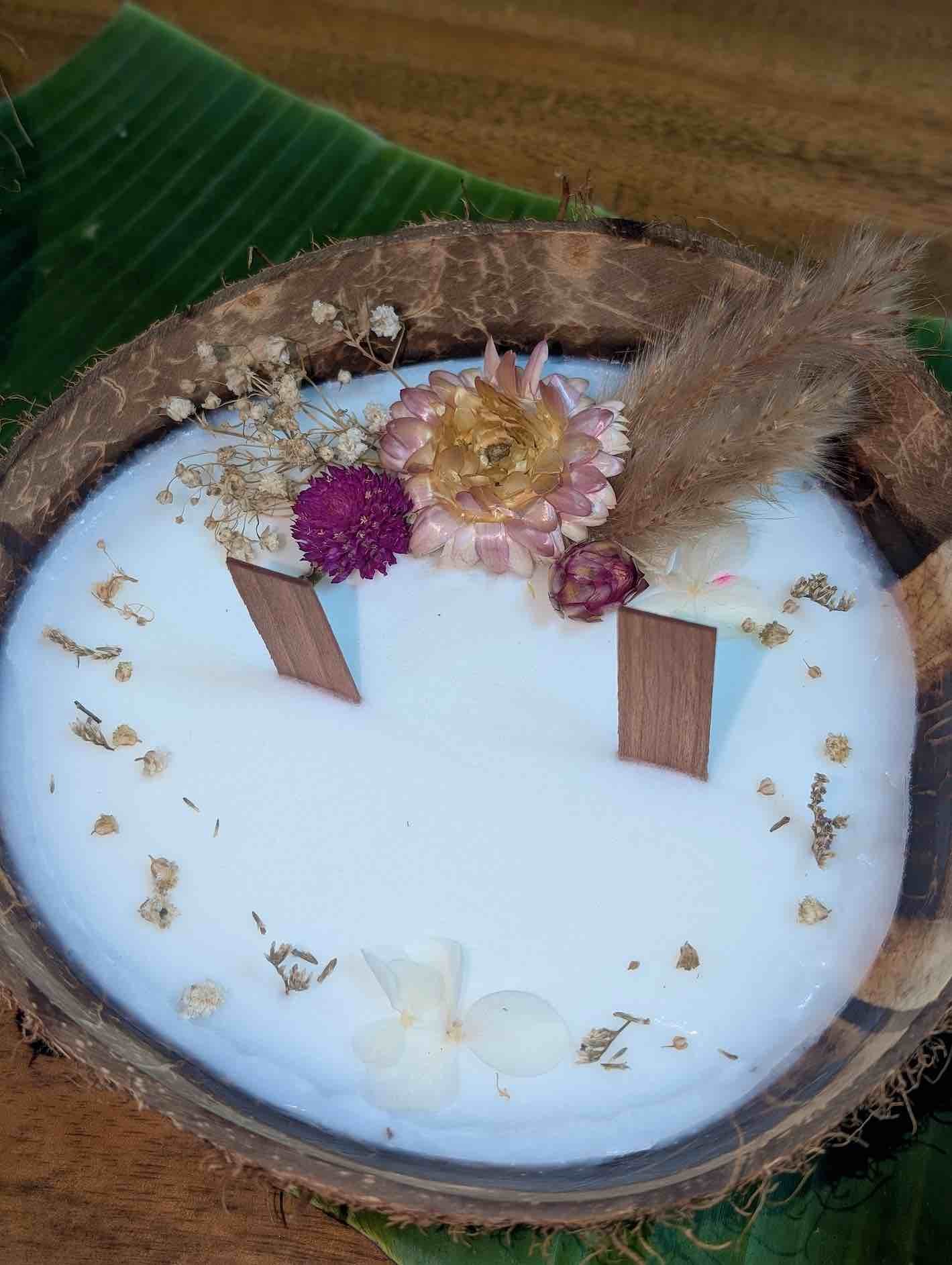 a candle decorated with seashells