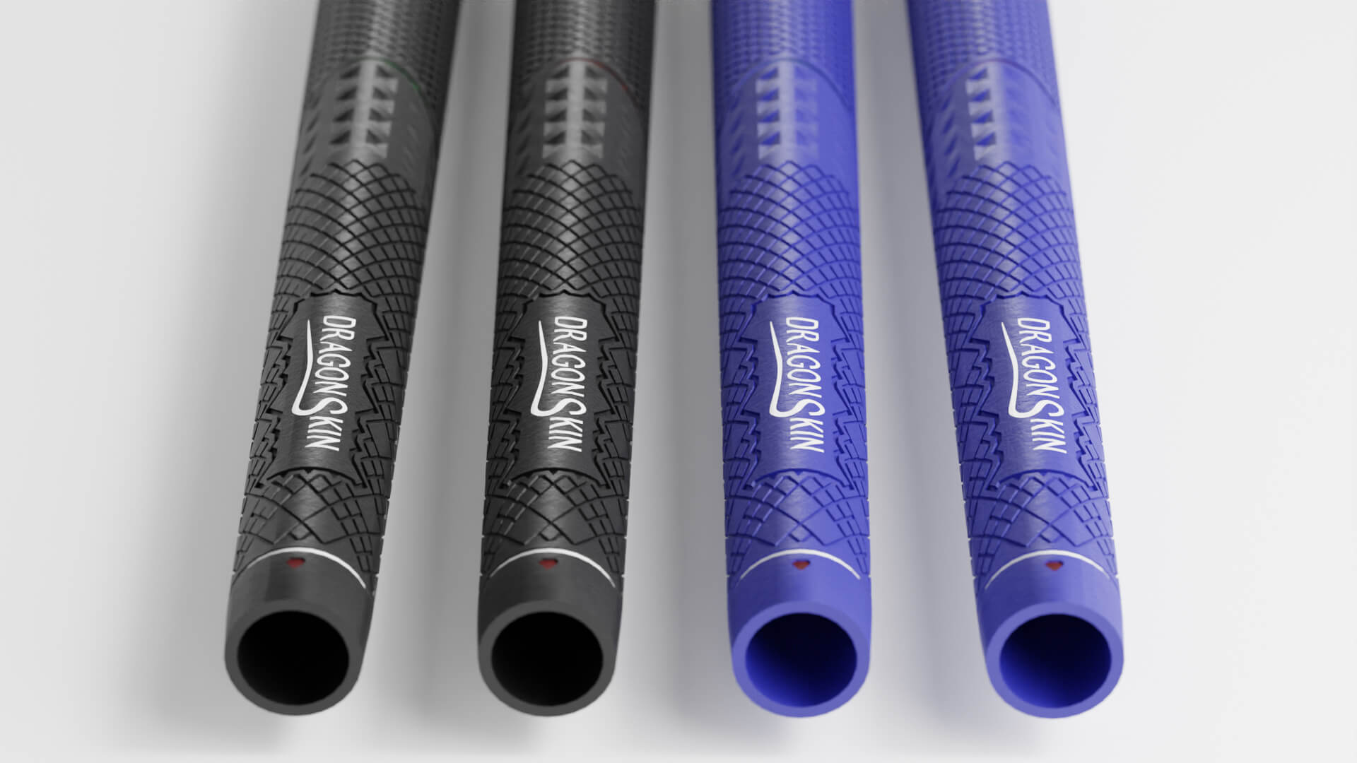 Four dragon skin golf grips, two black and two blue, laid out side by side on a white surface.