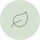 Ein grüner Kreis mit einem weißen Blattsymbol in der Mitte, symbolisiert Nachhaltigkeit oder Umweltfreundlichkeit.