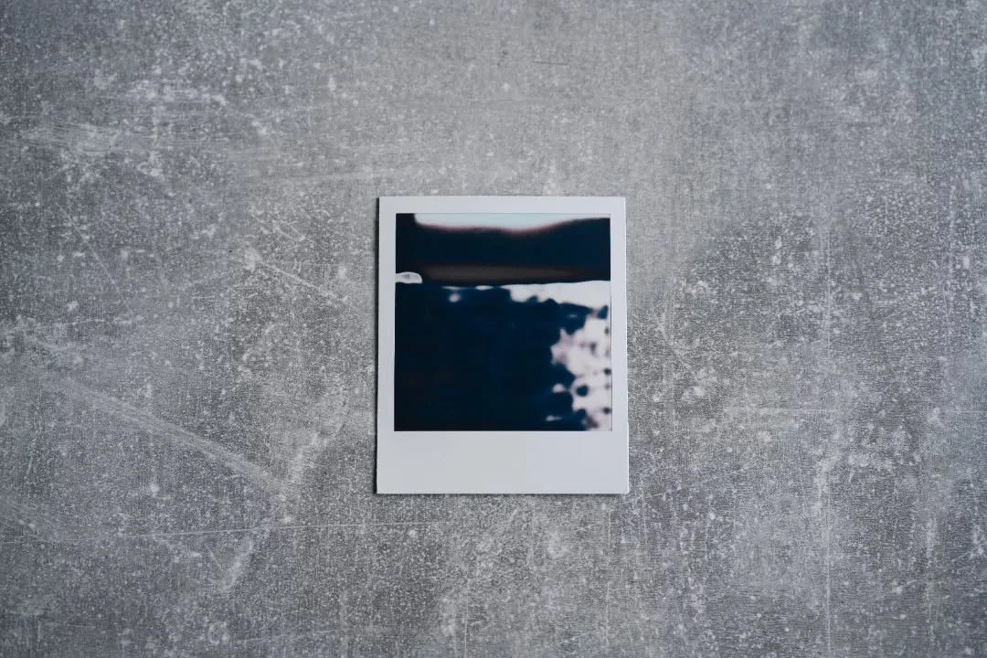 Not An Artwork, polaroid on fake wood, 2024