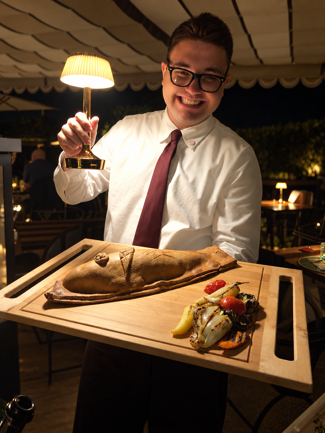 il-pellicano-waiter-presenting-fish-in-pastry-crust.jpg.PNG