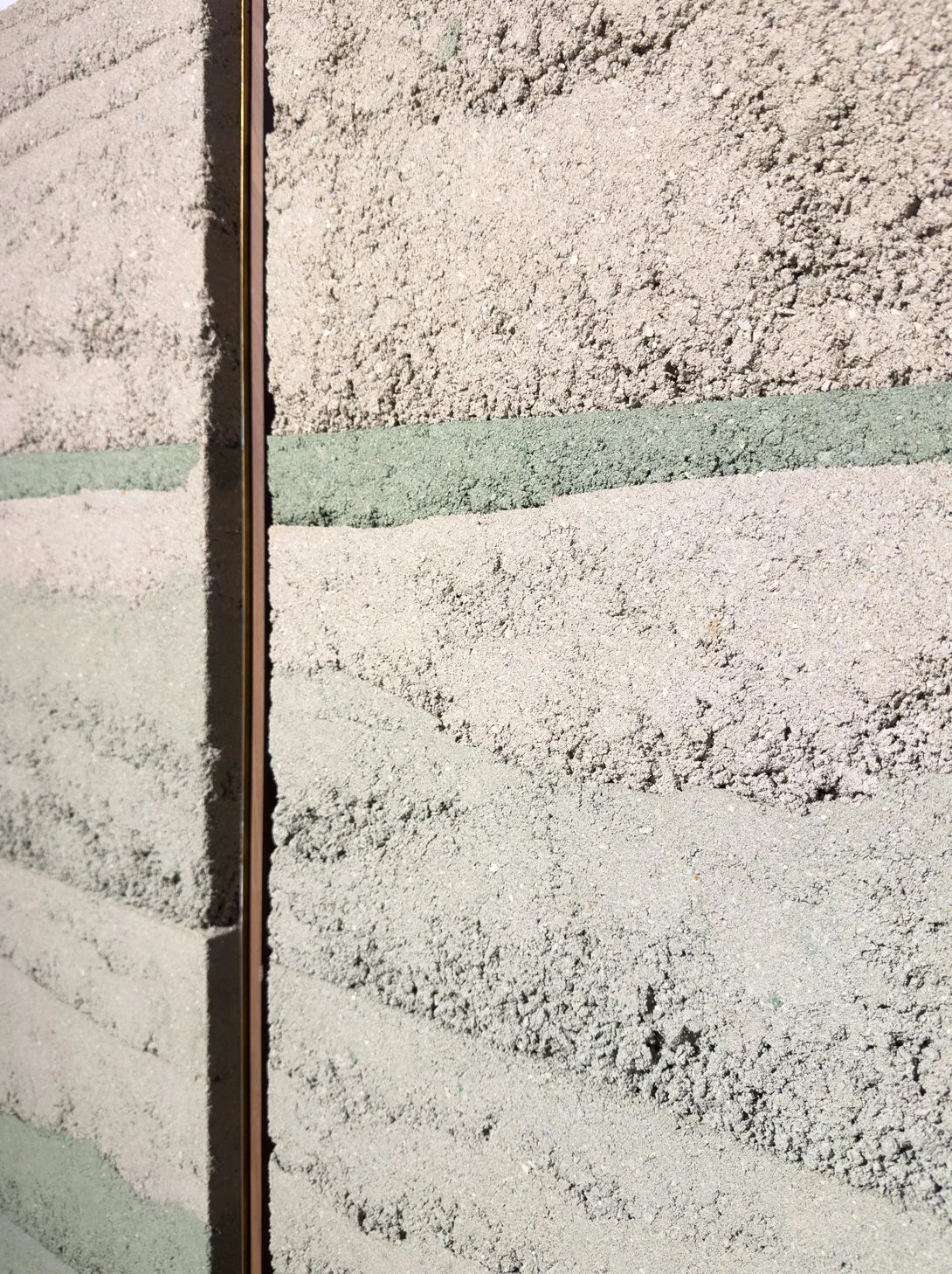 Close-up of layered rammed earth surface in CM009 – Green Rammed Earth Series by Adam Weismann, Claymoon
