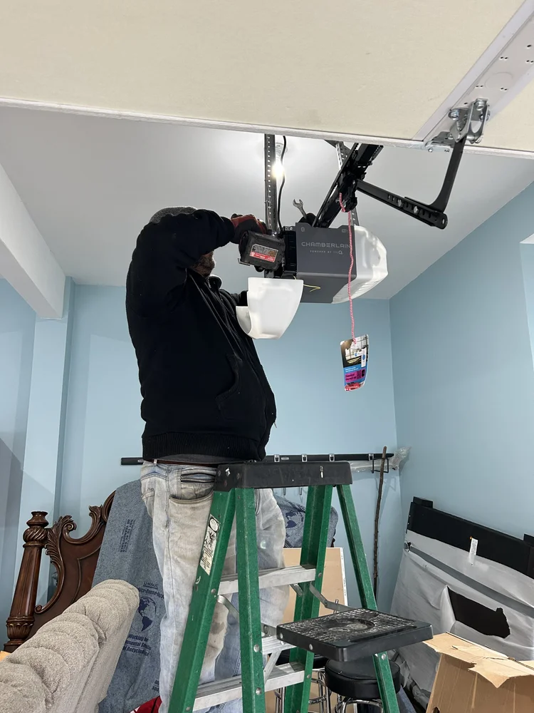 Technician working on a residential garage door opener