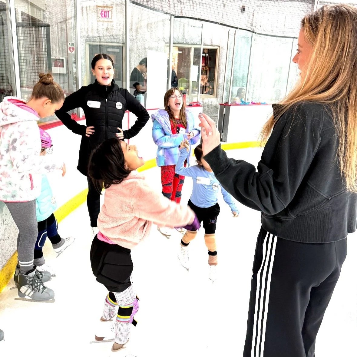 Coaches and skaters having fun during a figure skating camp or workshop in Austin
