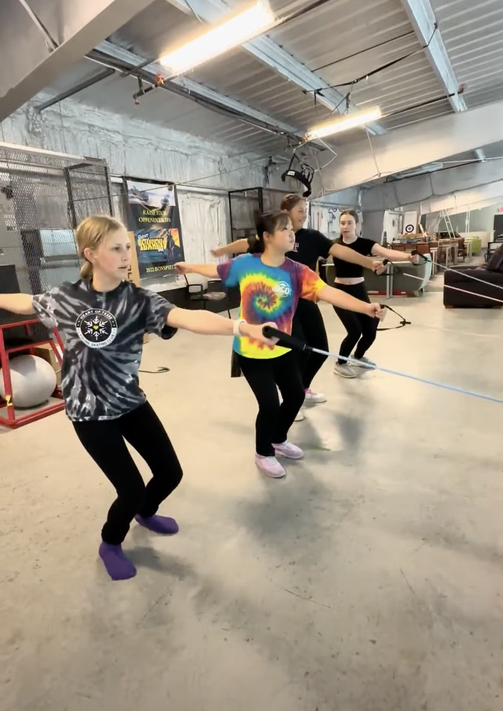 Off-ice figure skating training using resistance bands to work on muscle memory for air position