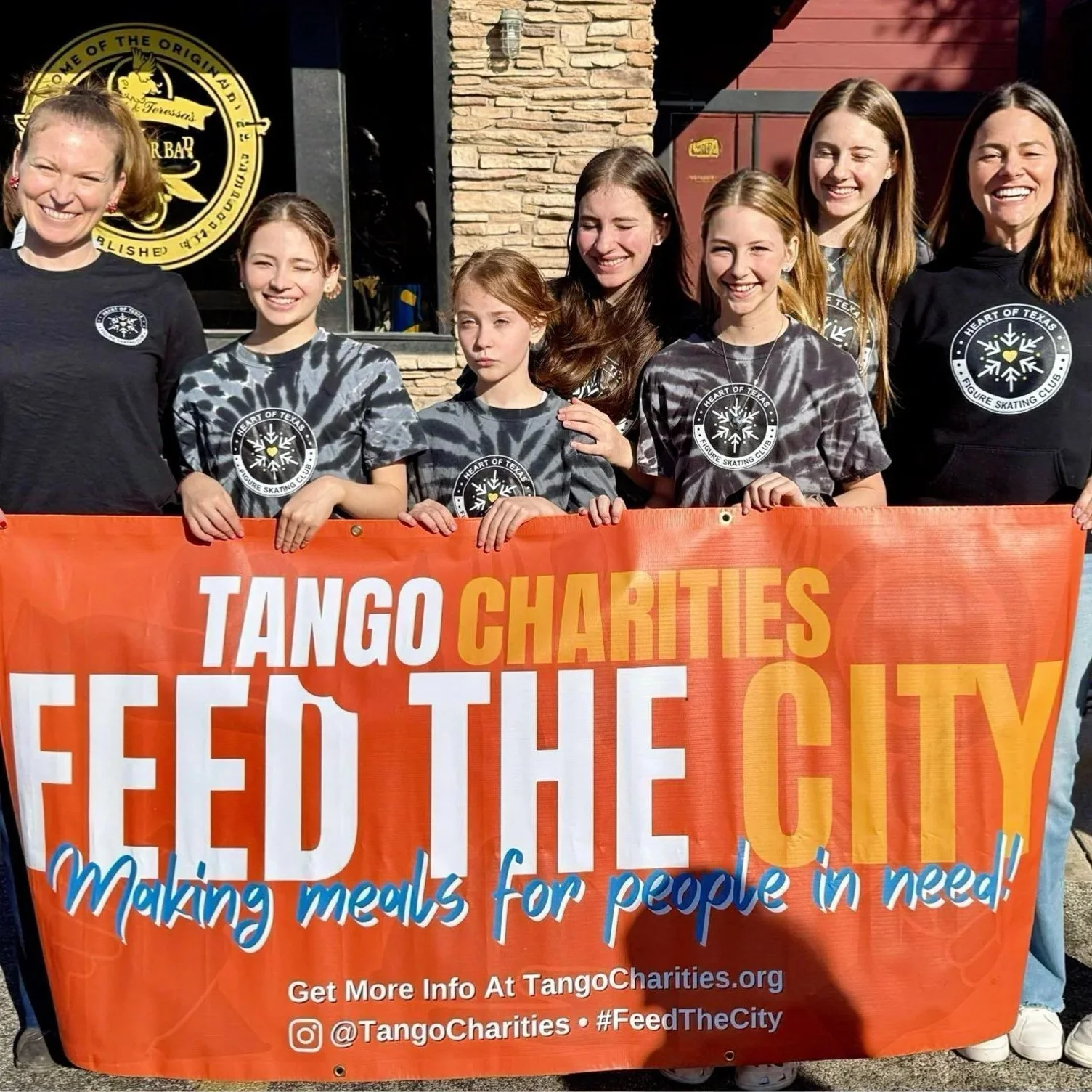 Skaters pose after volunteering with Feed the City