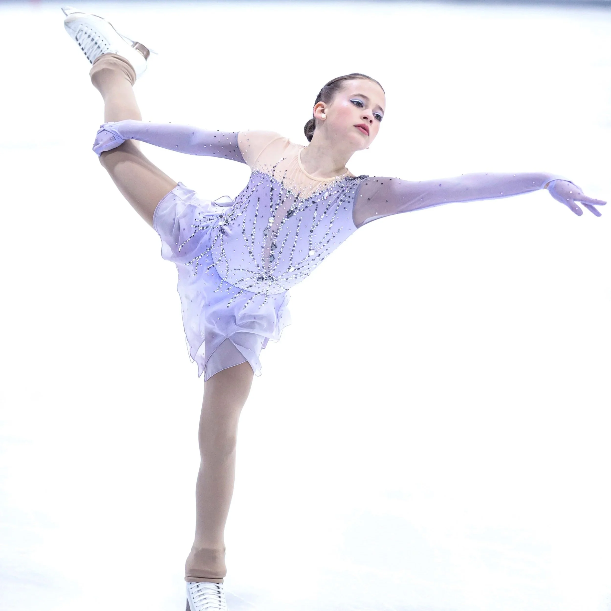 Figure Skater performing in competition representing the value of private lessons in Austin