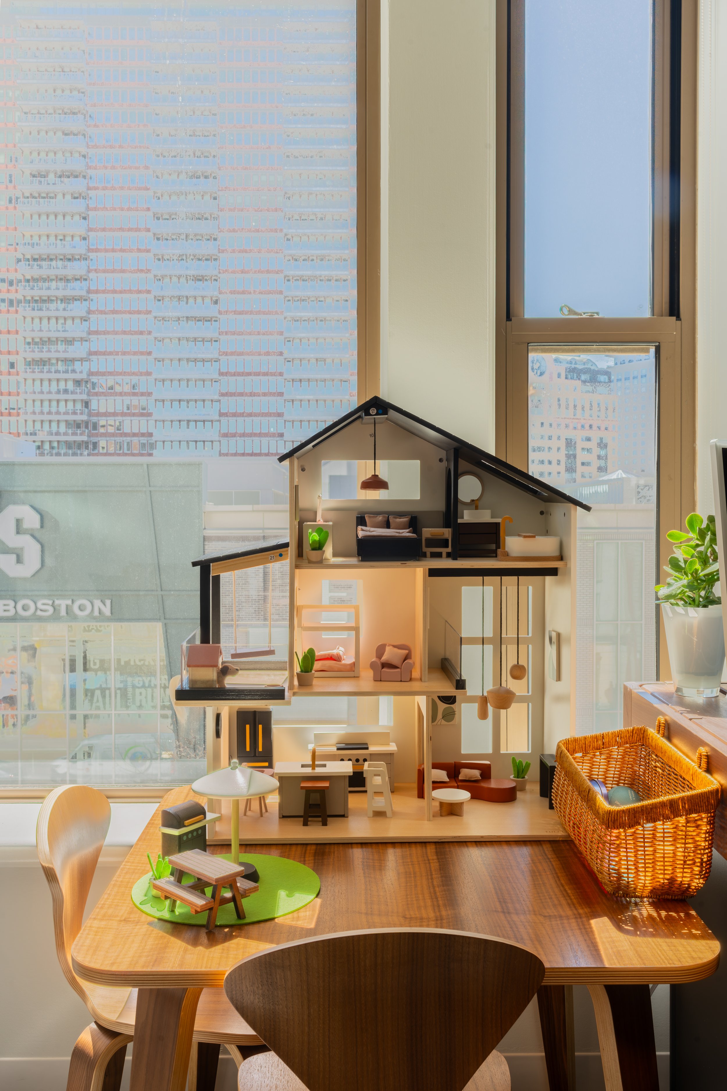 Dollhouse in Webster Clinic on table and sunshine coming in