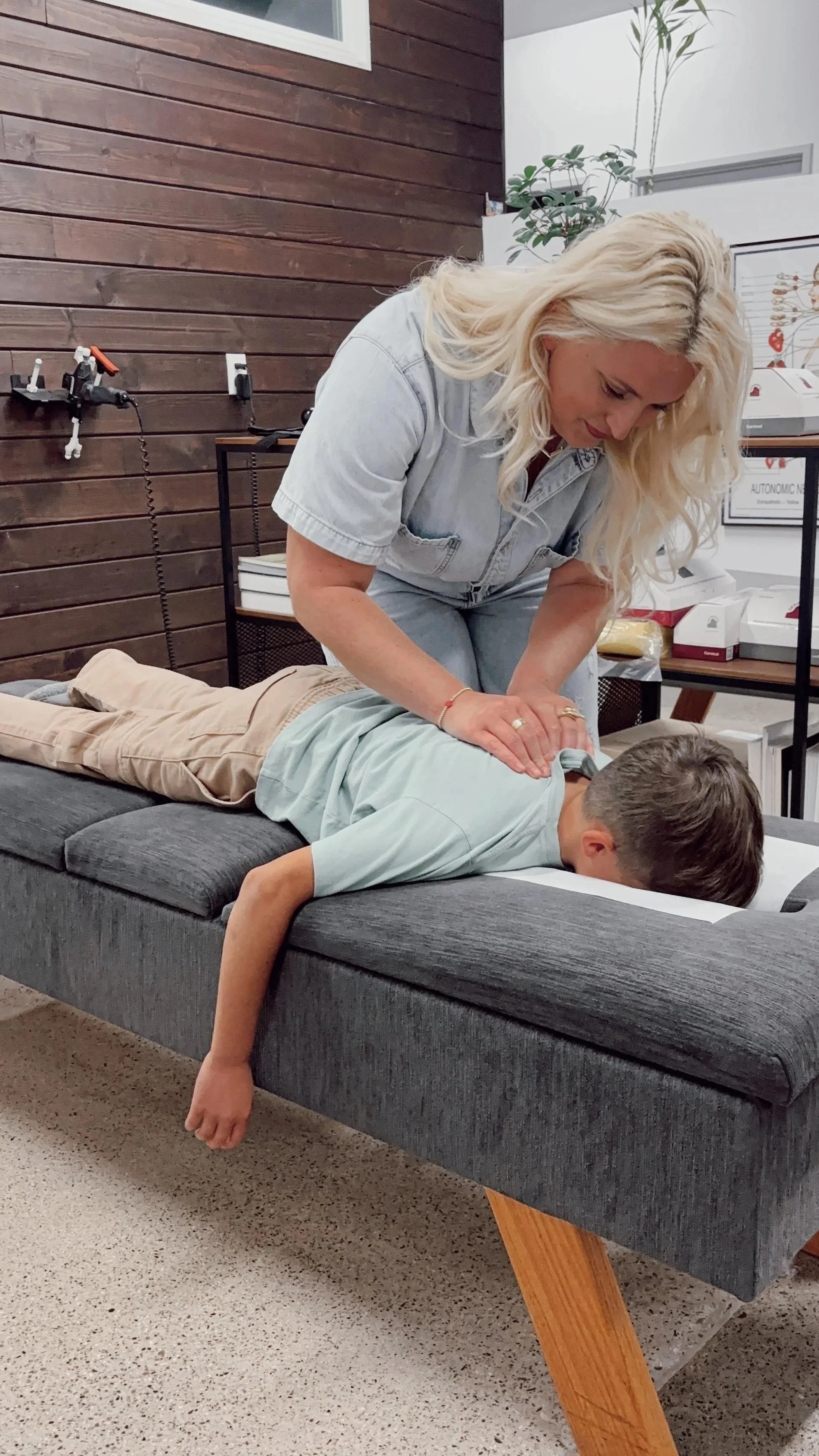 Gentle pediatric chiropractic adjustment — new patient special at House of Chiropractic