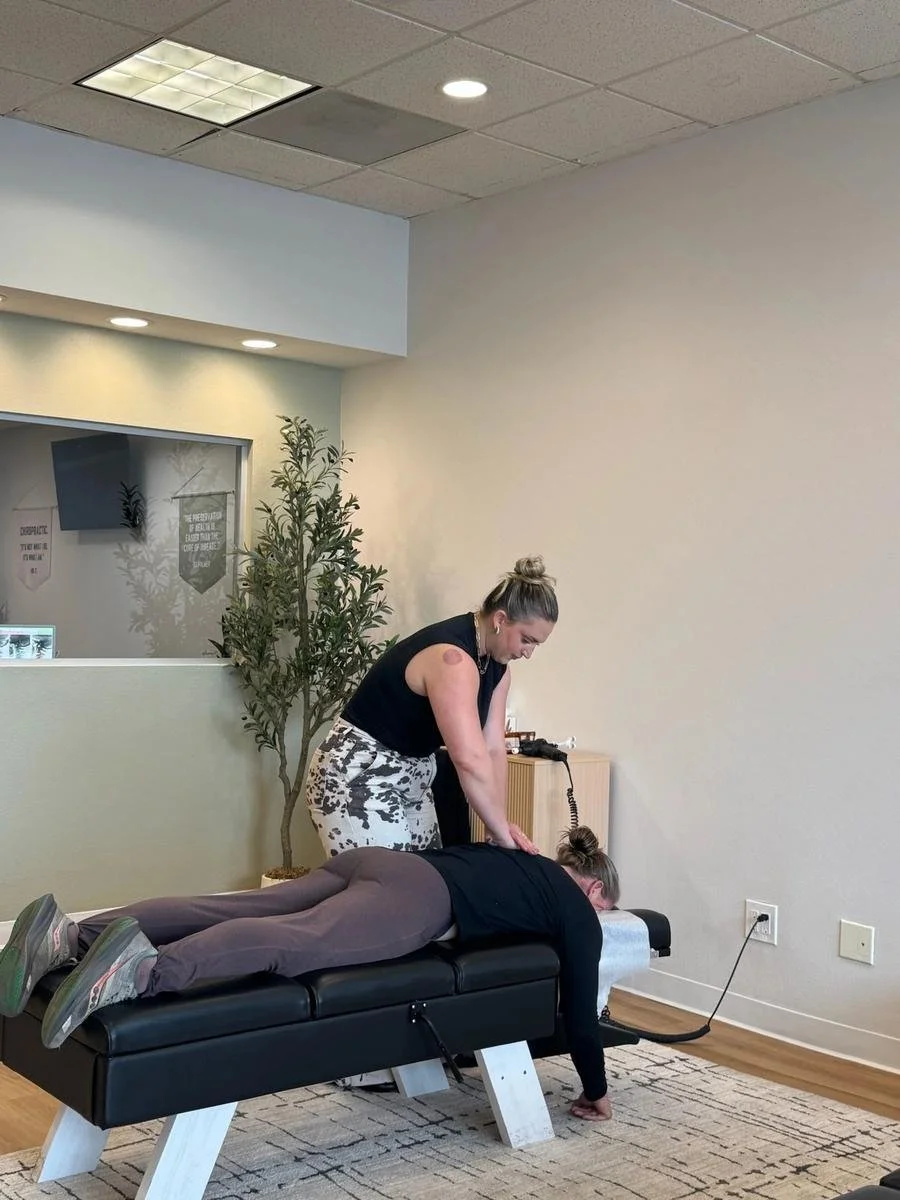 Instrument-assisted chiropractic adjustment supporting stress and nervous system relief