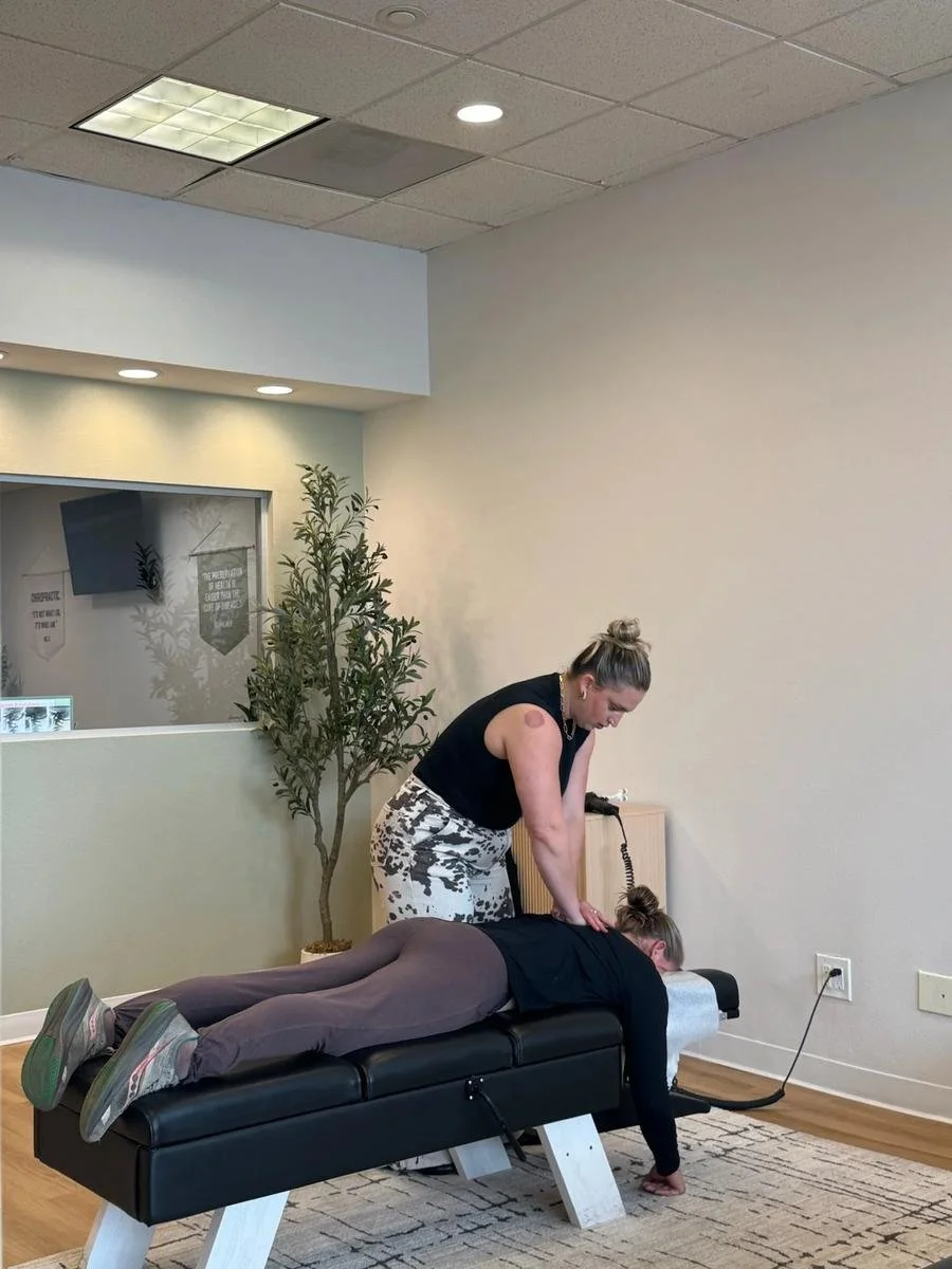 Chiropractor treating neck pain with an instrument-assisted adjustment in Huntington Beach
