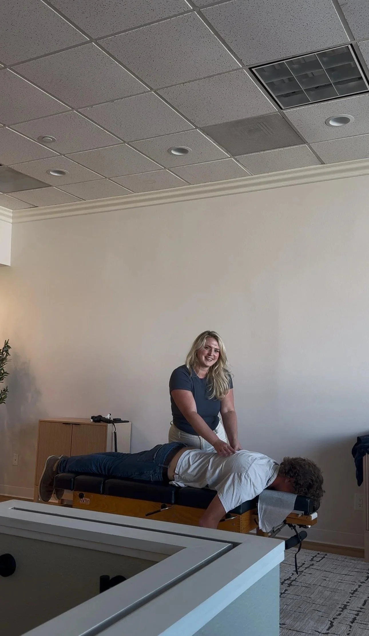 Chiropractor delivering a spinal adjustment to support immune and nervous system function