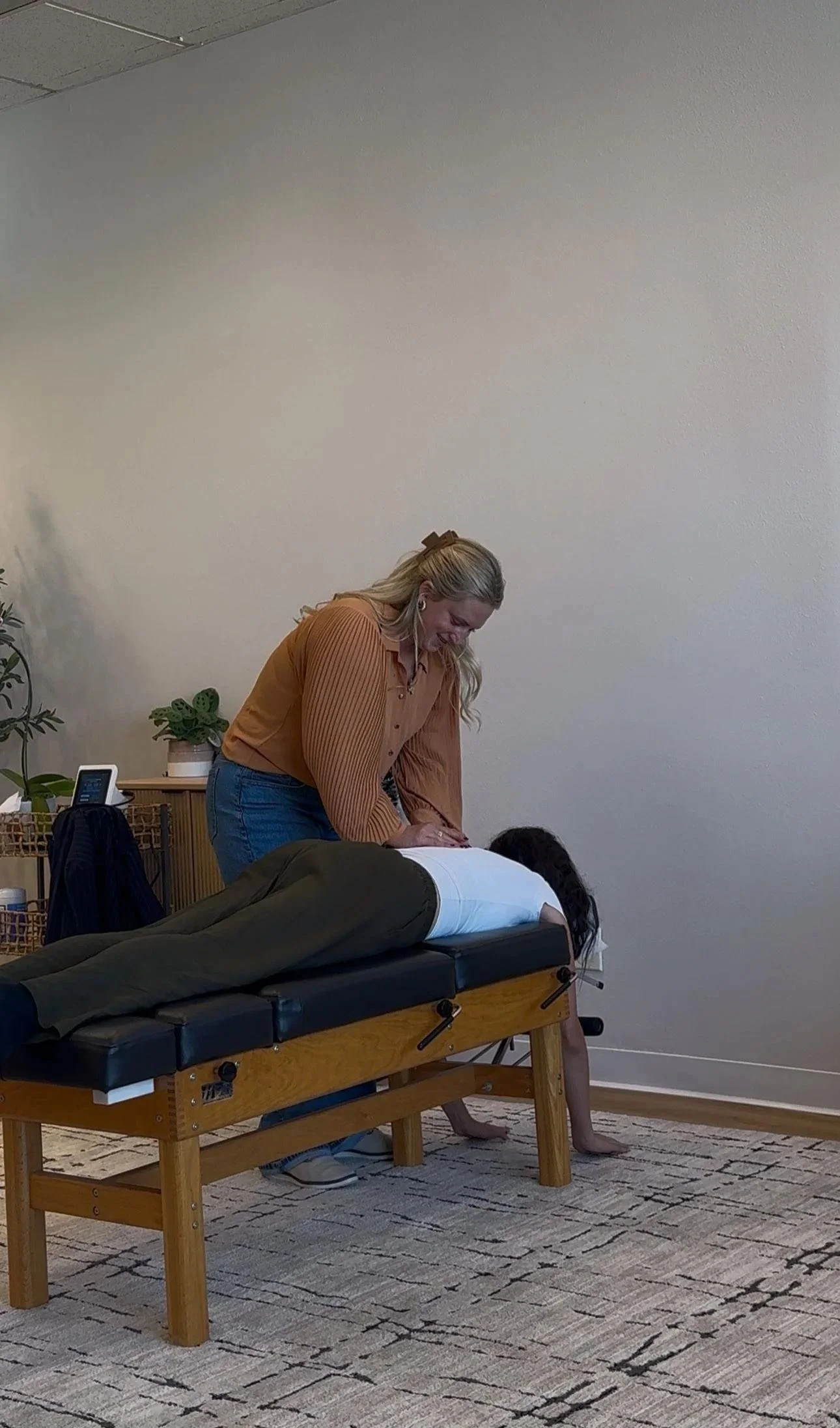 Chiropractor adjusting a patient as part of autoimmune support care