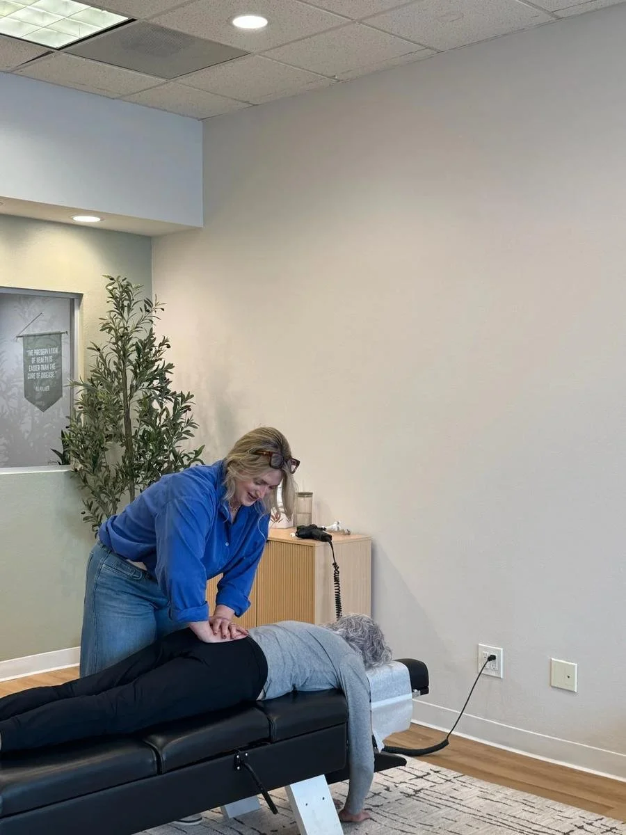 Chiropractor adjusting a patient, serving Garden Grove residents