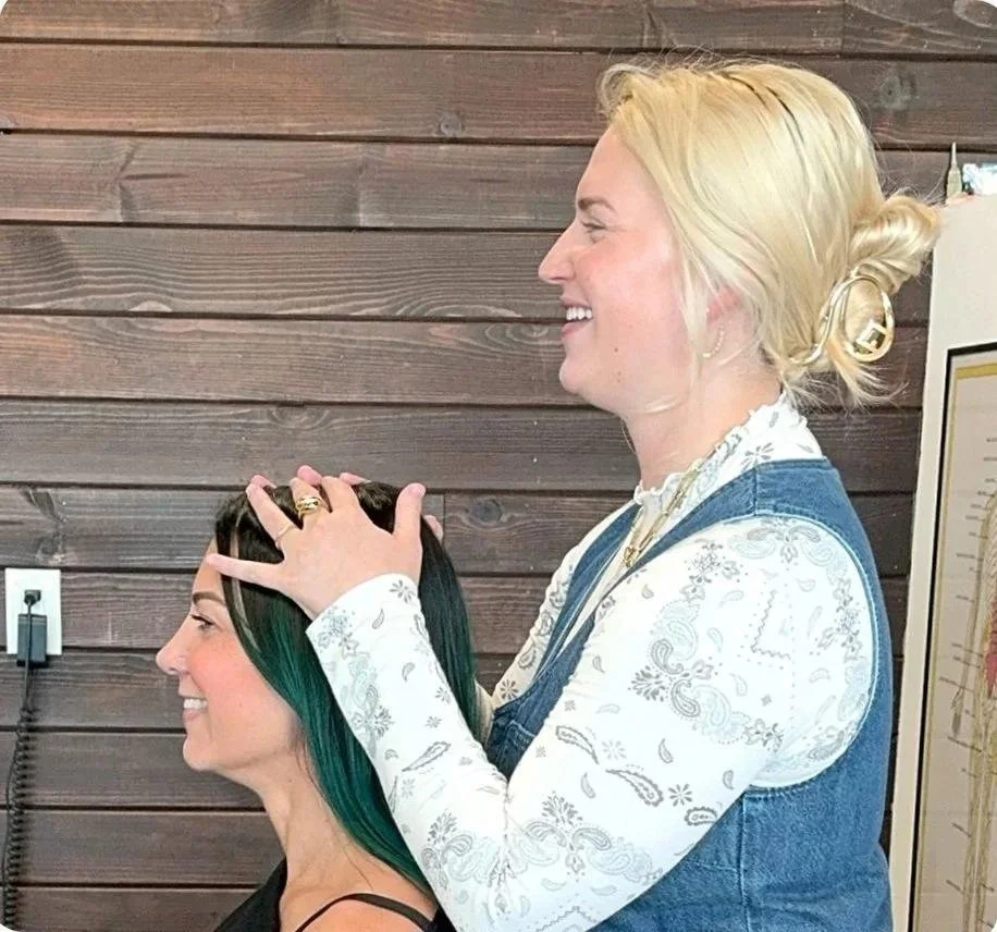 Dr. Corrin Harris treating a patient at House of Chiropractic