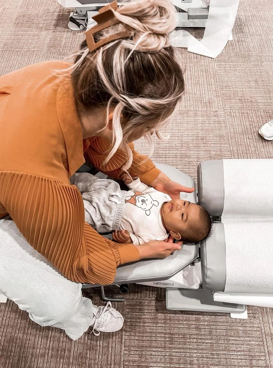 Gentle chiropractic adjustment for an infant at House of Chiropractic in Huntington Beach