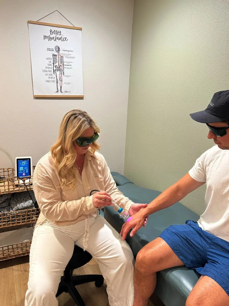 Cold laser therapy applied to a patient's forearm to reduce inflammation
