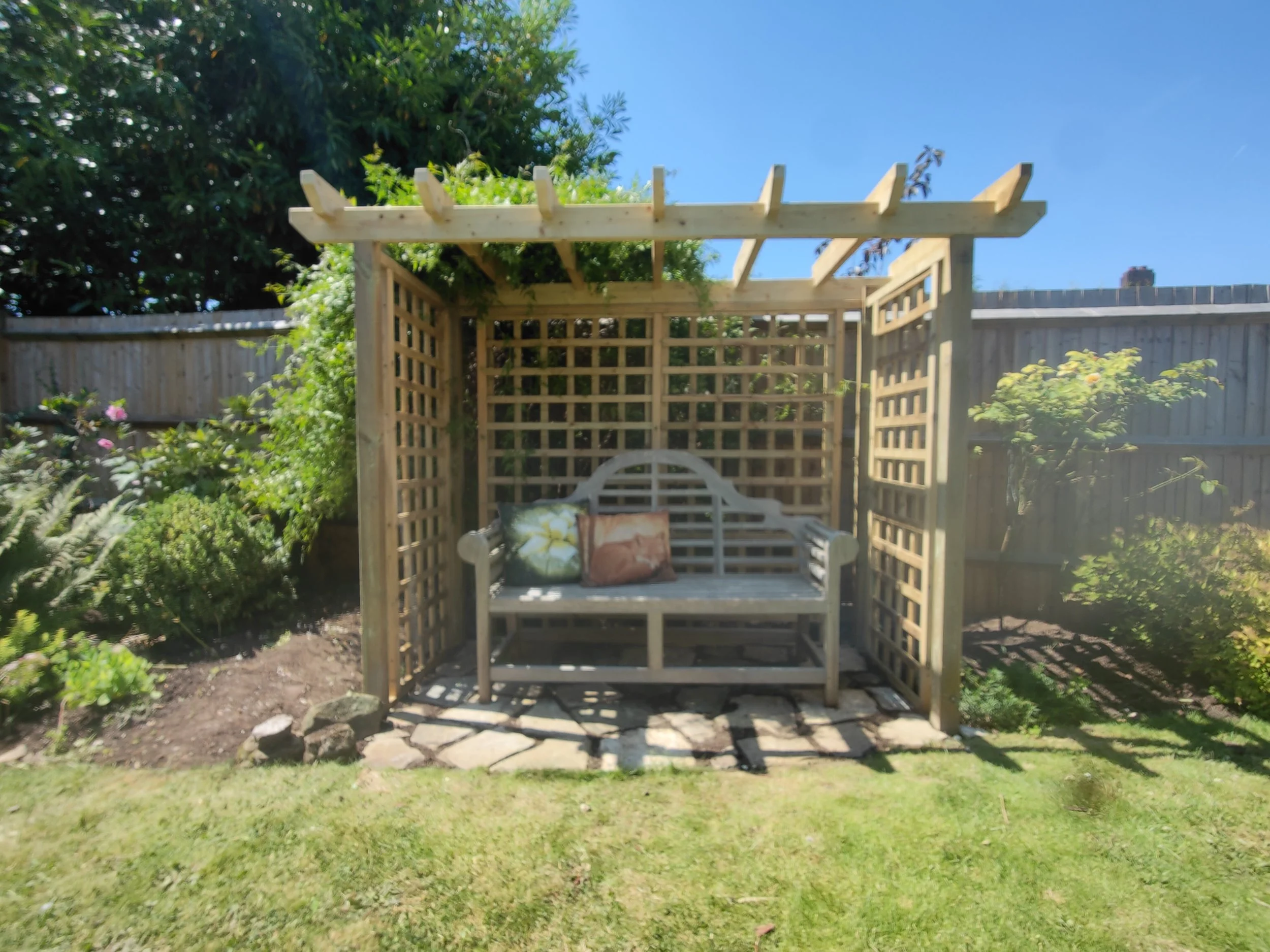 Peaceful Gardens Caterham and a focal point garden arbour for amazing clients in Purley.