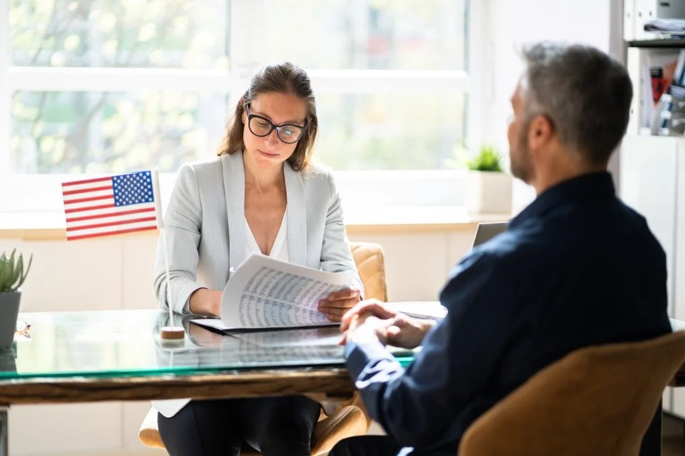An immigration attorney with a client.