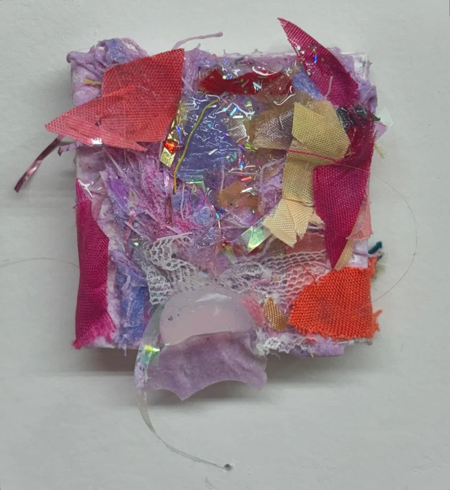 untitled (d) 
2x2x.5 in
sourced fabric, artificial flowers, resi, silicone, glitter, and a piece of hair that somehow got caught in the mix 
2024
.
.
.
.
.
.
.
.
.
.
.
#craftpainting #textureart #resinpaintings #artstudents